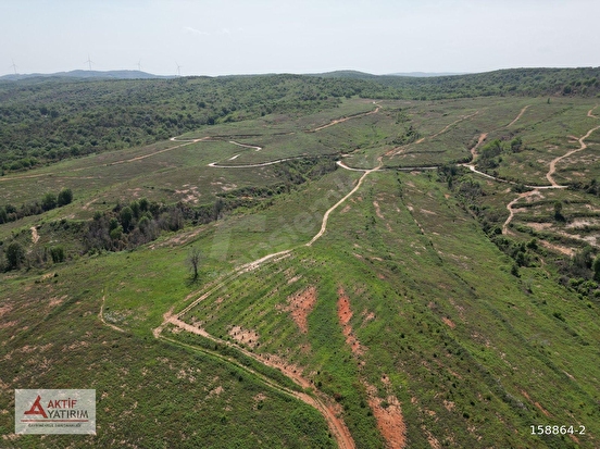PINARLI'DA FULL DENİZ VE DOĞA MANZARALI ZİRVE KONUMDA 14502 M2