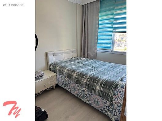 Kuşadası'nda güvenlikli havuzlu sitede satılık daire