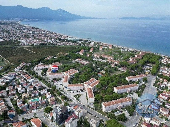 KUŞADASI DAVUTLAR ÖZLEM SİTESİ'NDE 2+1 BAHÇE KATI EŞYALI TEMİZ DAİRE